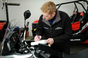 Mark at Winton Motorcycles hard at work completing a WOF